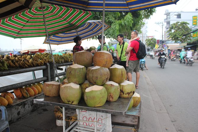 Afternoon Saigon Unseen Adventure by Scooter |Opt: Ao Dai Riders - District 4 and the floating market: how commerce works when boats are the street