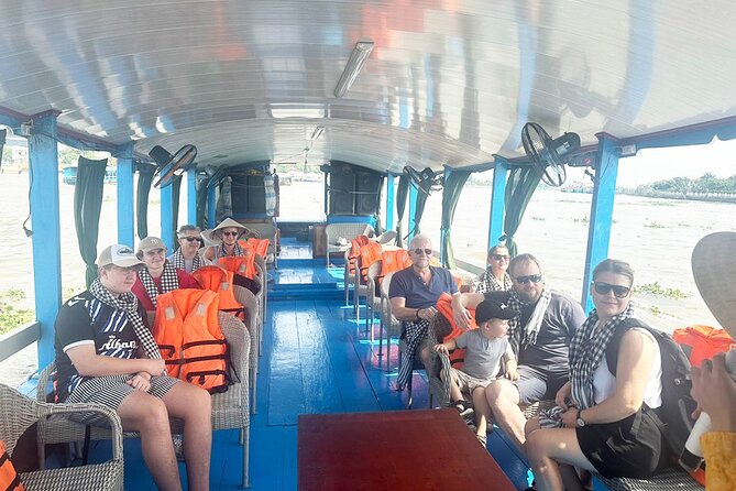 Cu Chi Tunnels and Mekong Delta 1 Day Tour from Ho Chi Minh City - Sampans, coconut canals, and the rice paper plus coconut sweets stops