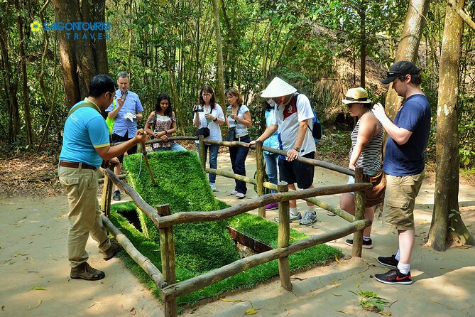 Cu Chi Tunnels - Half Day Morning or Afternoon Luxury Tours - Entering the tunnels: low ceilings, real tight spaces, and photo moments
