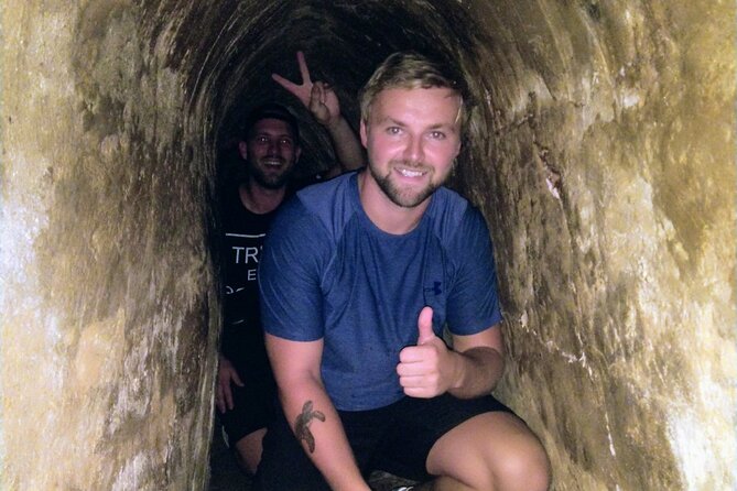 Cu Chi Tunnels tour In The Morning by DGT - Inside the Cu Chi tunnel system: cramped passages and real tactics