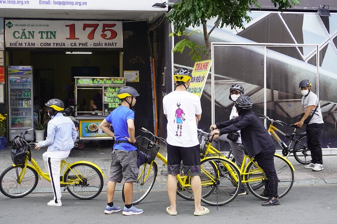 Half Day - Saigon Off-the-Beaten-Path - City Cycling Tour - District 10: the Umbrella Market and apartment blocks from 1968