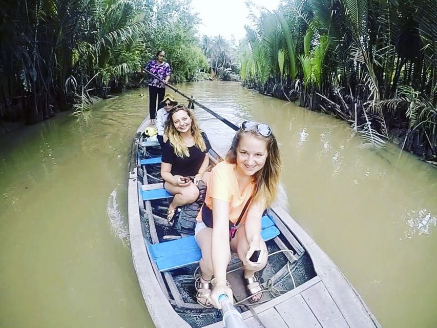 HCMC: Cu Chi Tunnels & Mekong Delta VIP Tour by Limousine - The coconut island and family stop: fruit, honey, and live music
