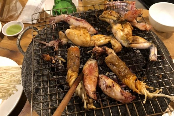 Ho Chi Minh City: Street Food Walking Tour with 12 Tastings - The scooter-led night food route in Ho Chi Minh City