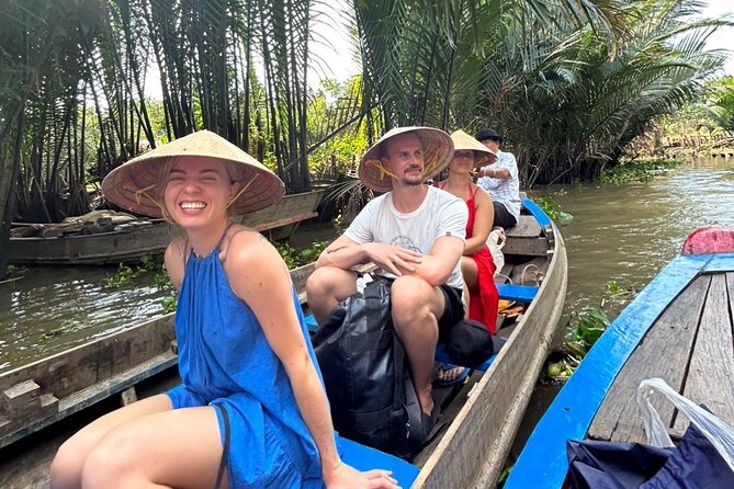 Mekong Delta Guided Tour from Ho Chi Minh City - Switching to a Row Boat: Narrow Canals and the Fun of Low Bridges