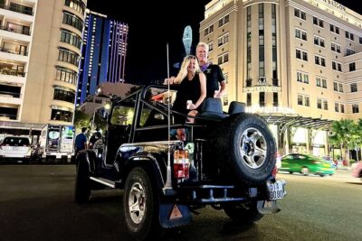 Private Jeep Tour Saigon by Night: Foodie & City Tour - Stop 1: Independence Palace by night lights