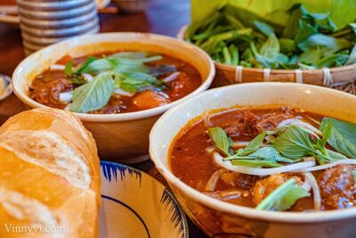 Private Street Food Motorbike Tour in Ho Chi Minh City - Stop 1: Street Food Man and the First Taste of Saigon on the Move