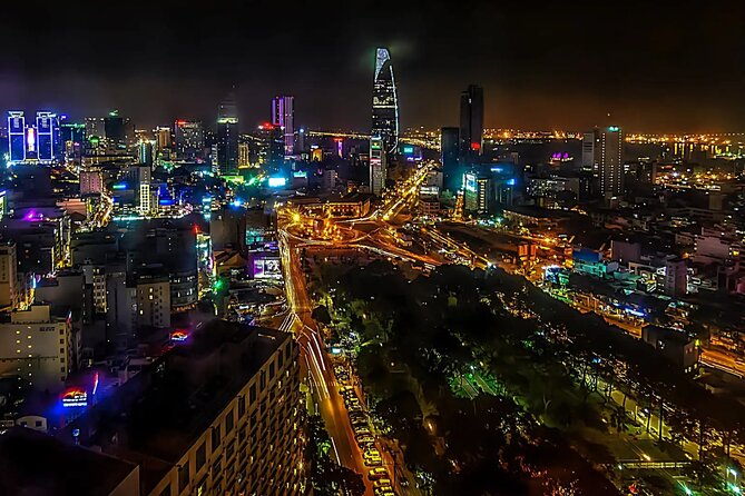 Saigon After Dark With Seafood, Beer & Live Music Bar - District 4 at night: beer or fruit juice, dessert, and a food-street walk