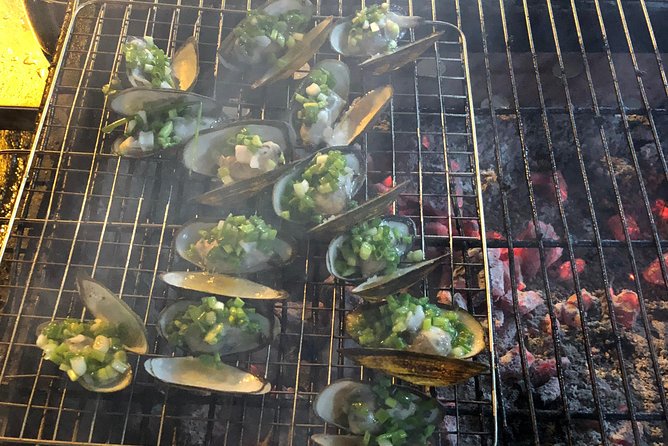 Saigon By Night and Street Food By Motorbike | Opt: Ao Dai Riders - Flower market stop: grilled oysters with black pepper and quail eggs