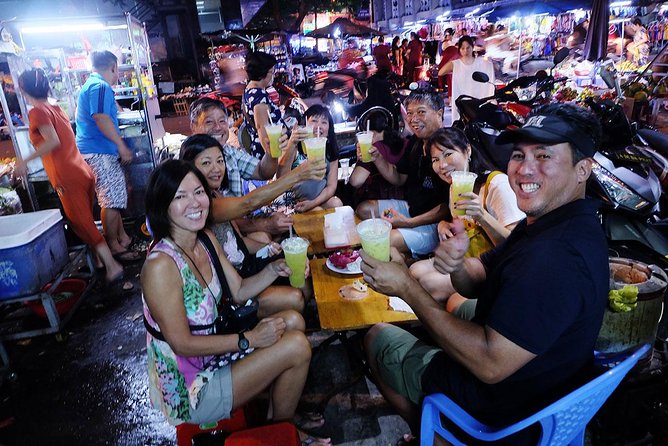 Saigon Night Sights & Local Food by Motorbike| Opt: Ao Dai Riders - Helmet, poncho, and the safety vibe you actually want