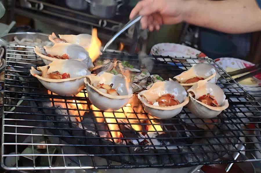 Saigon: Private Backstreets Walking Food Tour - Grilled oyster (or the swap): pepper sauce that actually tastes different