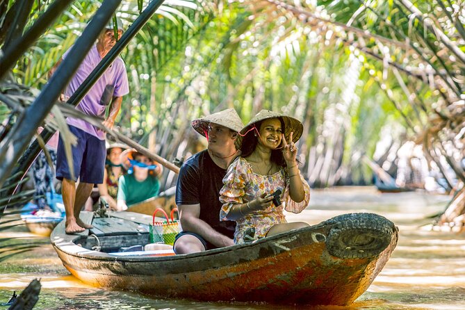 Small-Group Mekong Delta Day Trip: Boat Ride, Cottages & Pagoda - Motorboat canals, Rạch Miễu Bridge, and first Mekong views